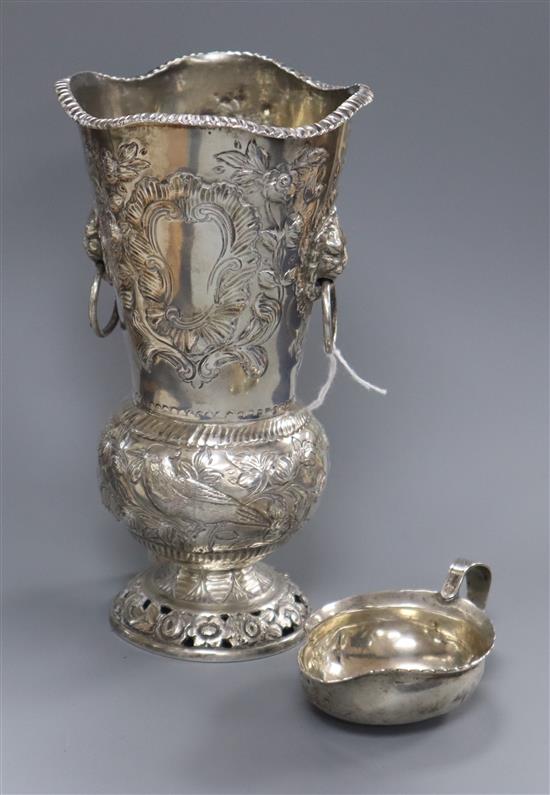 An Edwardian embossed silver vase, D & J Welby, London, 1907 and a white metal pap boat.